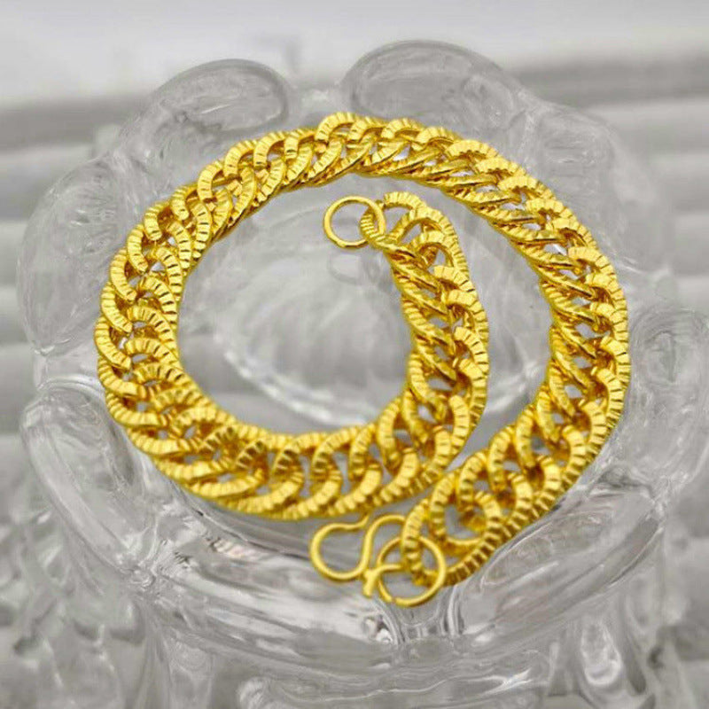 Vergoldetes Schmuckset aus Sand, bestehend aus Halskette, Armband und Ring